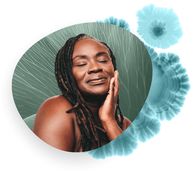 Young women with glowing skin smiling, eyes closed.